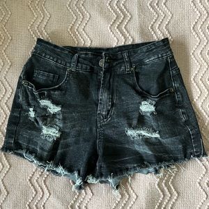 Distressed black‎ jean shorts with raw cut
